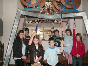 Children learn to ring at St Winnow Church. They are, from left to right:  Megan (13), Claire (adult), Joshua (12), Daniel (10), Matthew (12), Hester (10), and Hannah (11).  