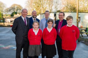 Bishop Philip is photographed with pupils and staff from the school.