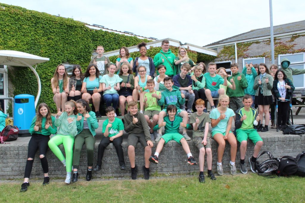 Mullion School pupils dressed in green to mark the first anniversary of the fire at Grenfell Tower. 