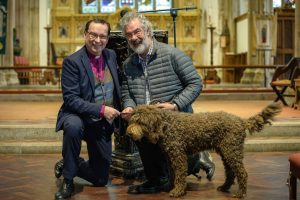 Bishop Philip with a safeguarding trainer and a dog